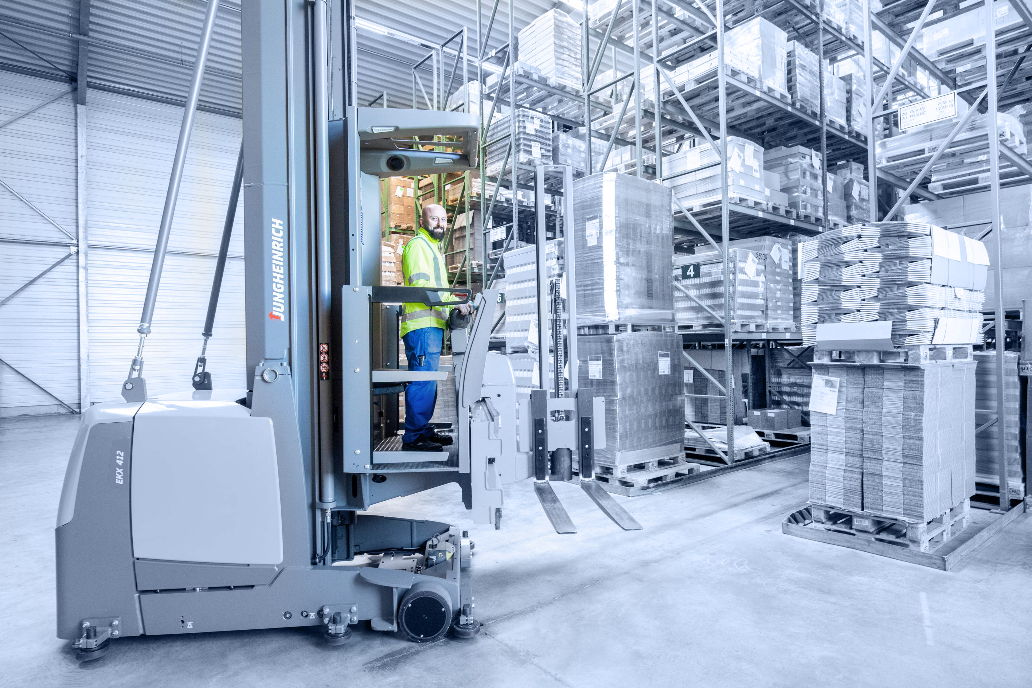 A storage worker on a forklift